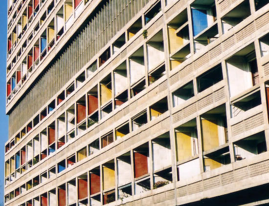 Le Corbusier’s Unite d’Habitation in Marseille - a concrete framed building with brightly coloured balcony reveals