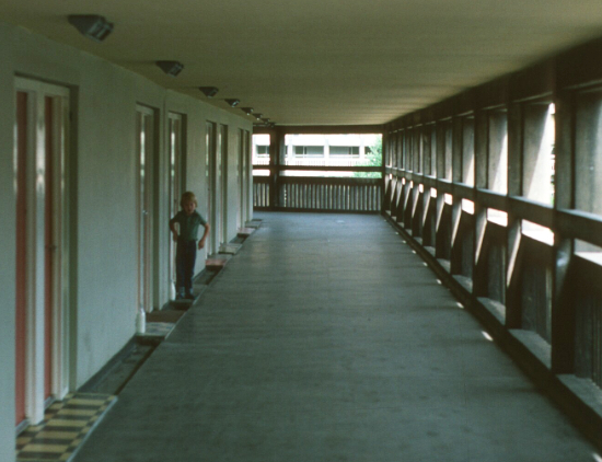 The building in the late 1970's showing the streets in the sky with a child looking out from a doorway